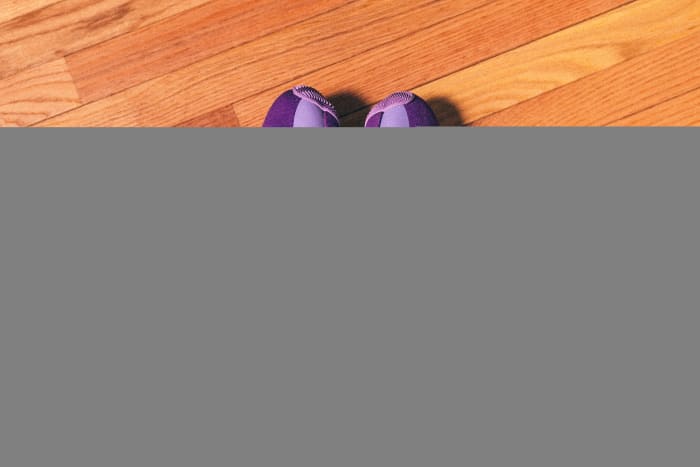 Side view of Trae Young's purple and black adidas sneakers.